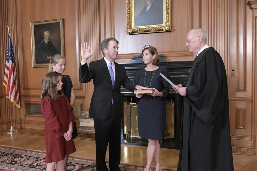 Retired Justice Anthony M. Kennedy, administers the Judicial Oath to Judge Brett M. Kavanaugh in the Justices' Conference Room at the Supreme Court Building on Saturday in Washington, DC.