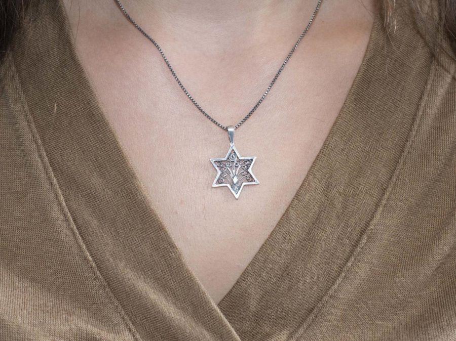 Opinions editor Leah Mensch wears a Tree of Life necklace. 