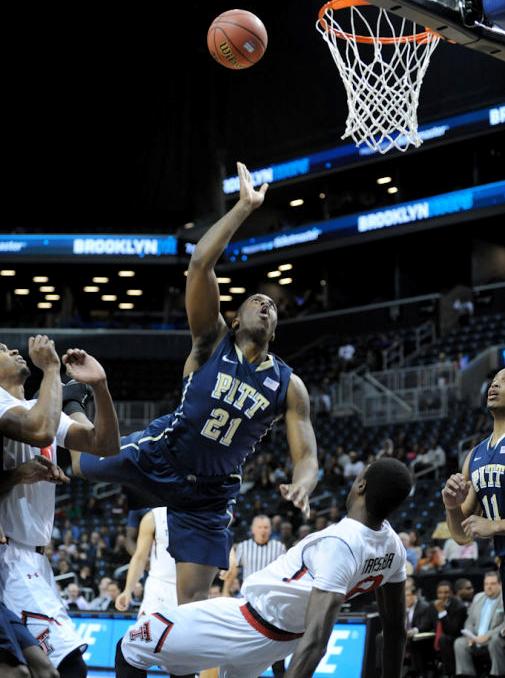 Former Pitt player Lamar Patterson (21) goes for a basket at a game in the Petersen Events Center in 2014. 
