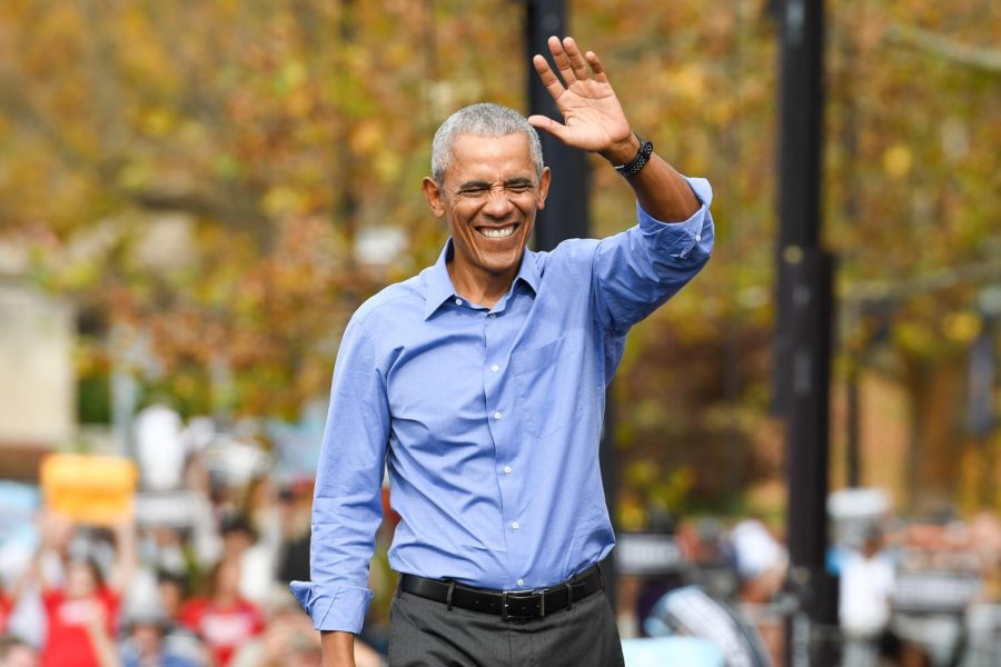 Former president Barack Obama waves to the crowd after speaking at a rally for Democratic senate candidate John Fetterman in Schenley Plaza Saturday afternoon.