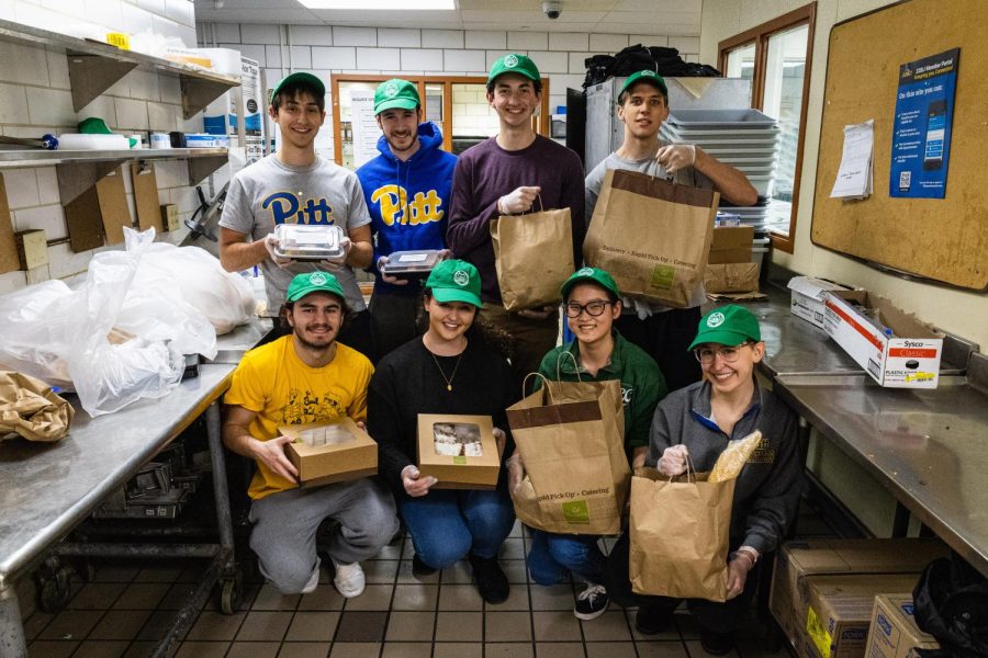 Members of Food Recovery Heroes pose for a photo in the Eatery Tuesday afternoon.