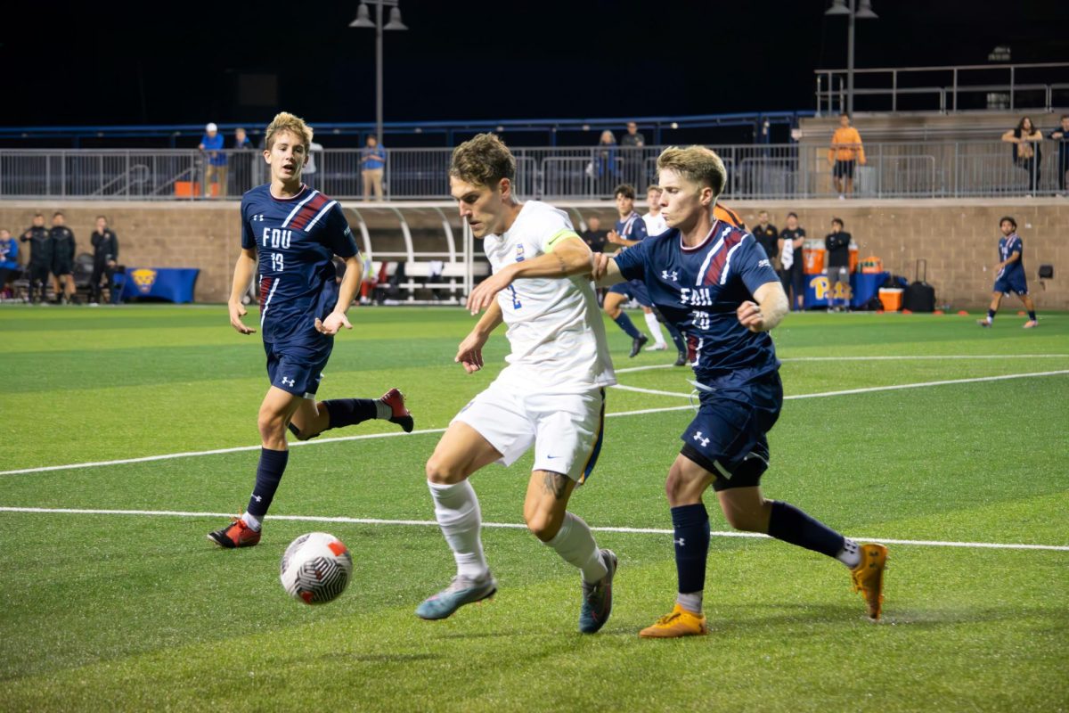 Sophomore Defender Jackson Gilman (2) fights for the ball during Monday night’s match against FDU.