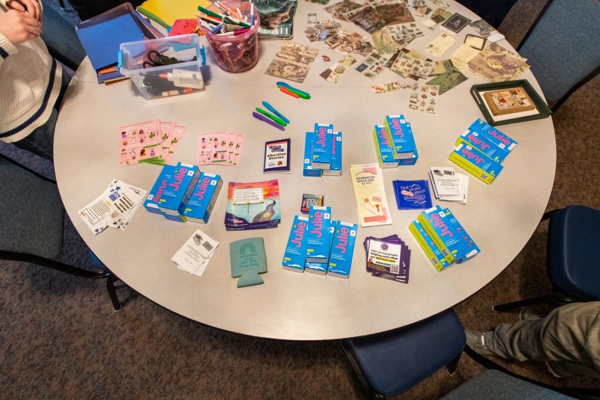 Reproductive health products are displayed on a table for the Pittsburgh Reproductive Justice convention.