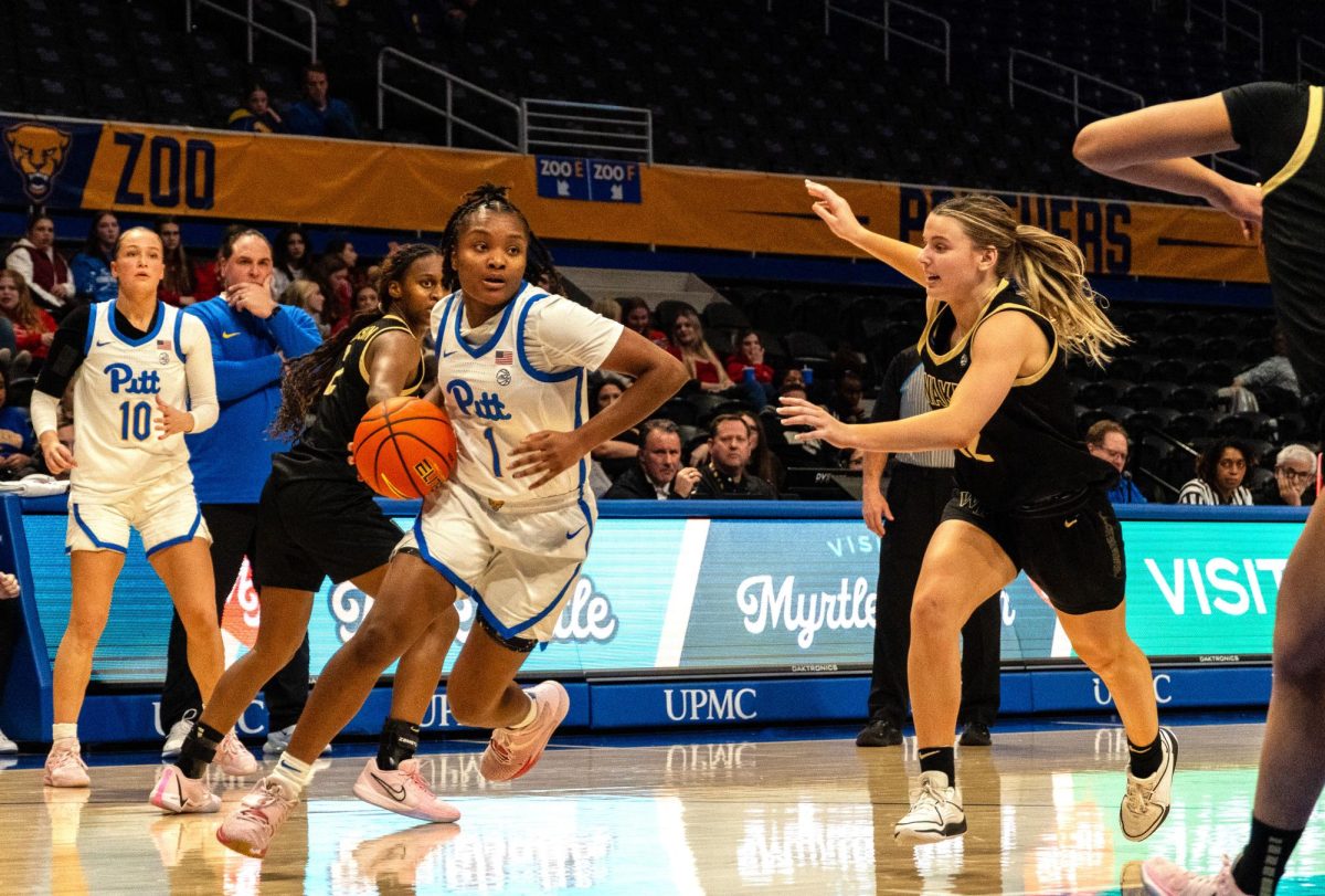 First-year guard Aaryn Battle (1) dribbles the ball during Thursday evening’s game against Wake Forest in the Petersen Events Center.