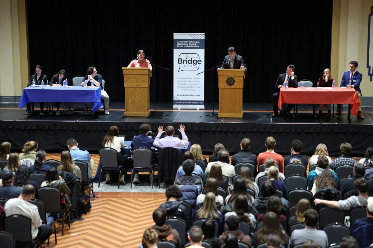 Henry Cohen, from College Democrats at Pitt, and Josh Minsky, from College Republicans at Pitt, debate a range of political topics at an event hosted by Bridge Pittsburgh on Tuesday night in the William Pitt Union Assembly Room. 