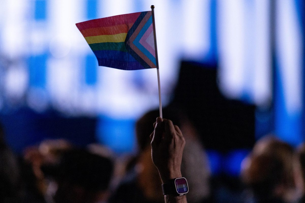 A supporter waves a pride flag prior to Kamala Harris’ rally on Nov. 4, 2024.