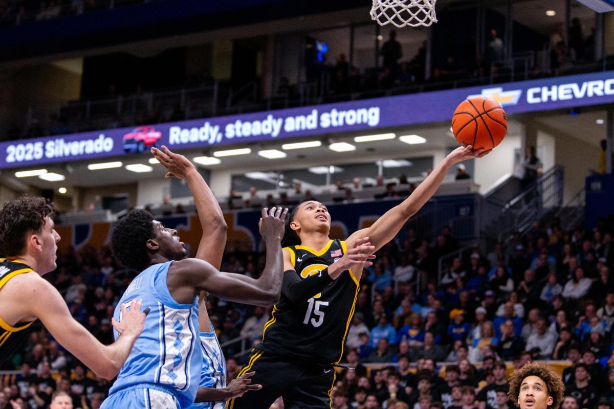 Sophomore guard Jaland Lowe (15) attempts a layup during Pitt men’s basketball’s game against UNC on Jan. 28 at the Petersen Events Center.
