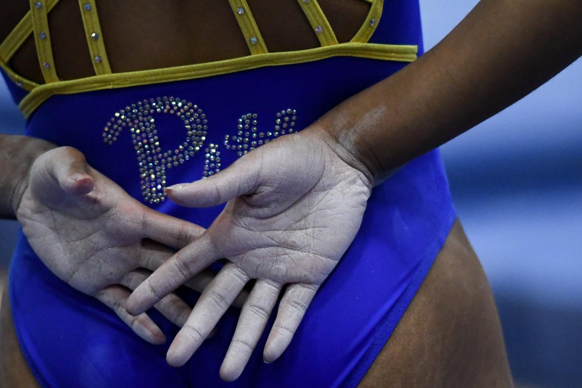A Pitt gymnast prepares for a routine during Saturday’s meet against the Kent State Gold Flashes at the Fitzgerald Field House on Jan. 13, 2024.
