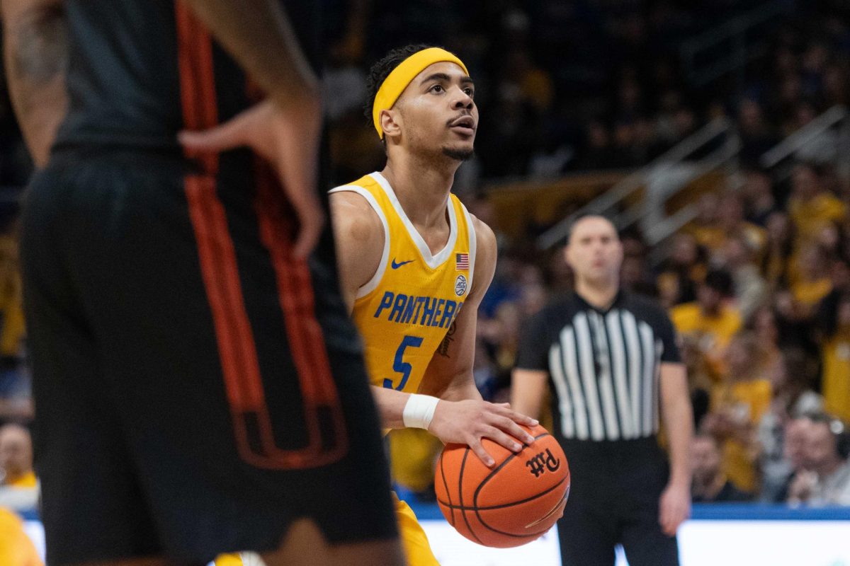 Senior guard Ishmael Leggett (5) prepares to shoot the ball during the game against Miami in the Petersen Events Center on Saturday, Feb. 15.
