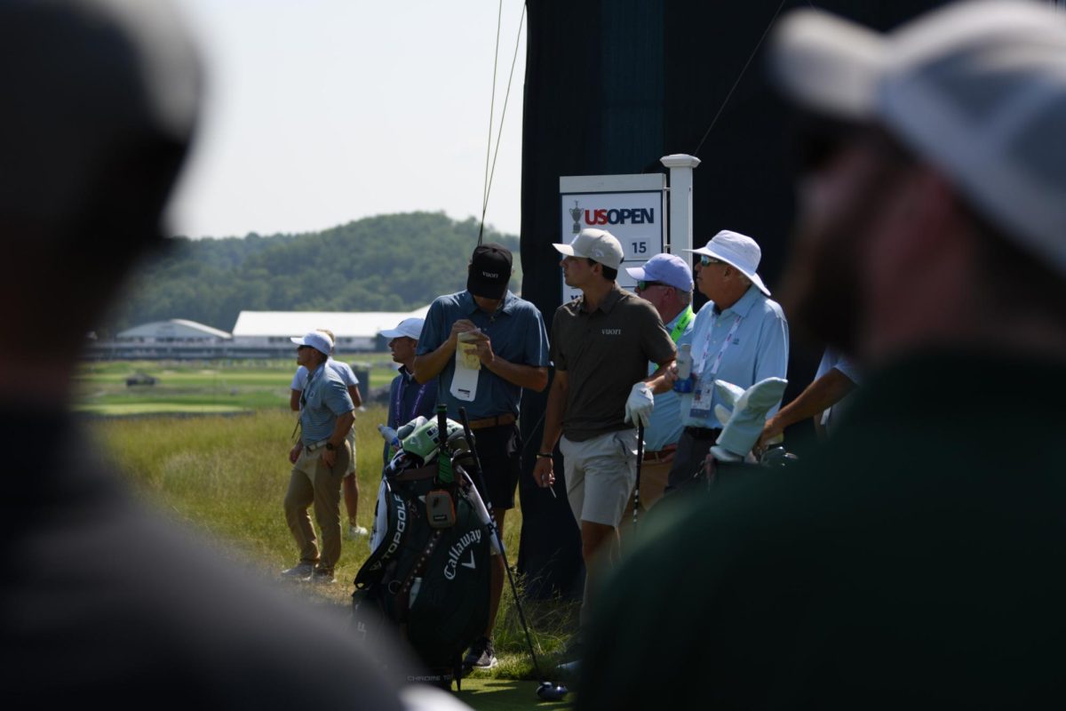 Jackson Buchanan and Sam Haynes prepare for Buchanan's tee shot on the 15th hole at Oakmont Country Club on Wednesday, June 11